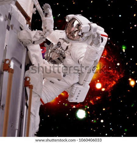 Astronaut and the spaceship in deep space. The elements of this image furnished by NASA.