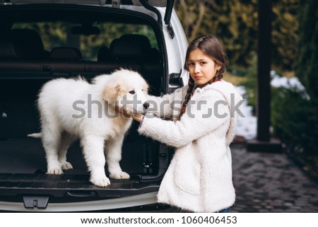 Girl with dog outside