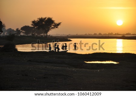 Local people washing clothes in Niger river