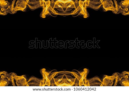 Abstract natural gold smoke on dark background. movement soft golden fire flame. Beauty texture of amazing magic golden smoke on black background. art wall interiors backdrop marble design
