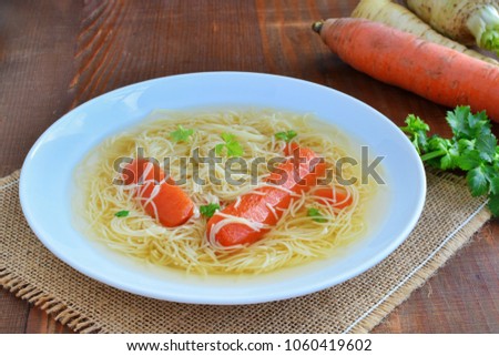 Bouillon clear beef or chicken broth with noodles and vegetables