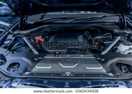 new car engine under vehicle hood