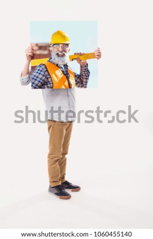 little boy pretending to be professional builder, isolated on white