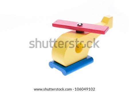 Colorful wooden toy helicopter on a white background