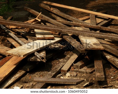 pile of old wood plank in construction site