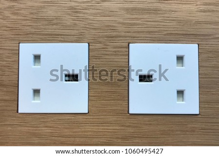 Plug socket on wood background