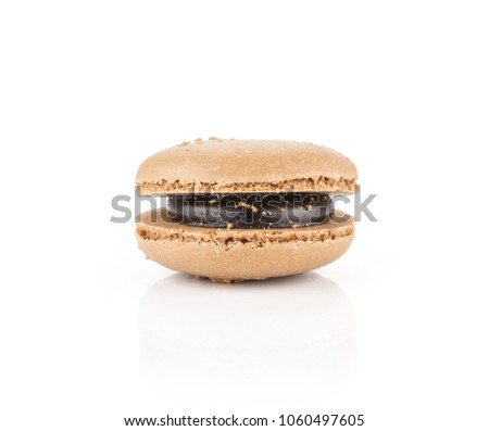 One chocolate French macaron isolated on white background
