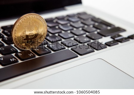 Bitcoin coin symbol on laptop. Crypto currency sign. Future concept financial currency.