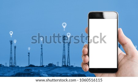 Hand holding mobile phone white screen, telecommunication towers and location icons sign background