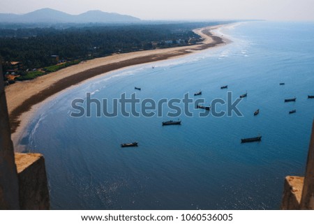 View of the coast with boats in Karnataka India. View from the tower