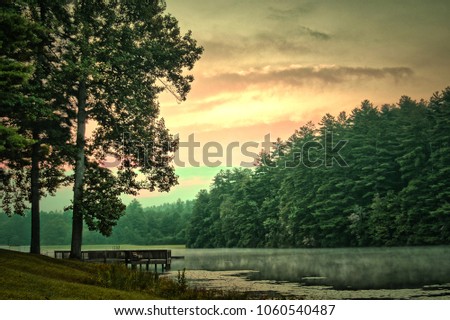 Sunrise over a serene lake