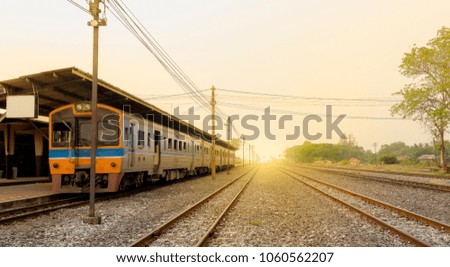 Railway Track and Vintage Old Train Waitting 
Passenger in Local Station on Sunset