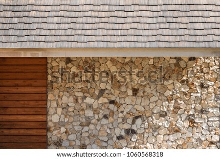 Wall outside of the house. Buildings with stones and wooden with roofs. To see is beautiful and modern.