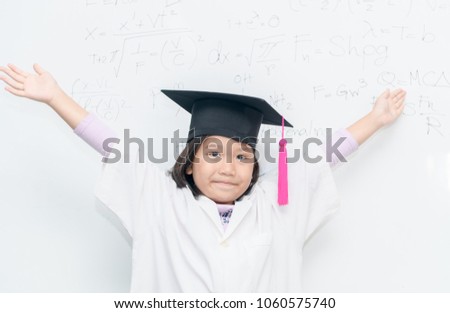 cute asian scientist girl wear graduation hat smile on white borad with scientific equation, science and educaton concept