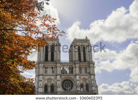 Exterior shot of medieval monument of Notre-Dame Cathedral on background of blue sky