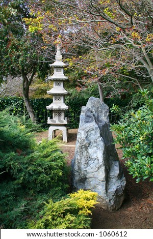 A photo of a stone temple in a Japanese garden