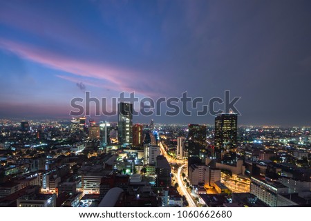 Panoramic view of Mexico city downtown skyscrappers at sunset time before night.