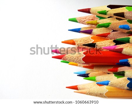 group of colored pencils on white background