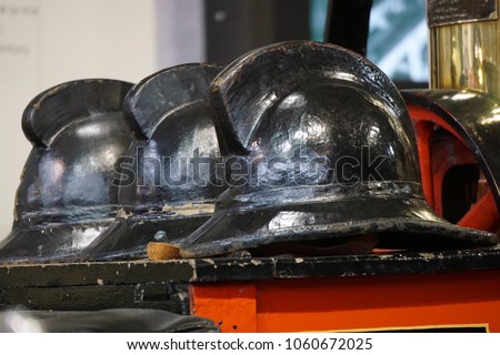 Old wooden fireman's hats.