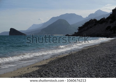 A sea view with mountains