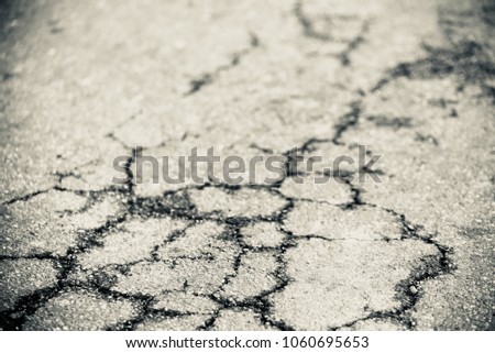 Black and white concrete surface with cracks of a highway road unique stock photo