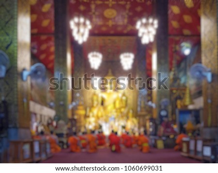 monks are chanting front buddha statue on Dharma in temples. To purify the mind and prepare for the Dharma day of the Buddha, Activities on Buddhist Monks Day, blurred photo