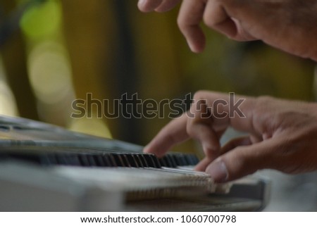 playing keyboard with natural background