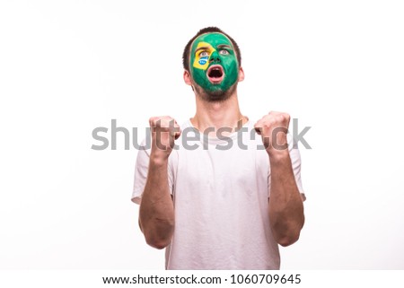 Happy victory scream fan support Brazil national team with painted face isolated on white