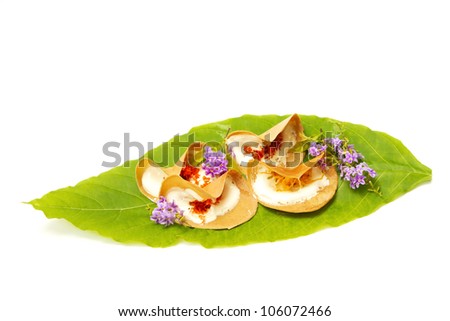 Thai dessert on green leaf ,Thai sweets with coconut milk and eggs, similar to a small crepe