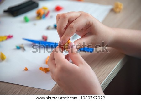 children's hands molded from plasticine on the table