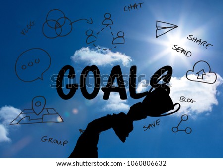 business hand with trophy shade in the sky with graphic about goals behind