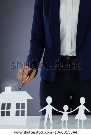 Cut outs of house and family with model