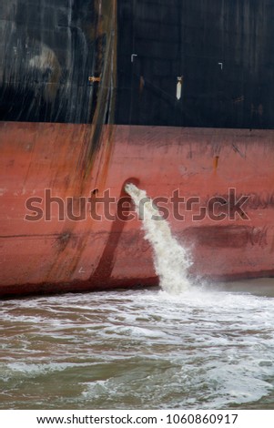 Closeup of the bilge water on the cargo ship Royalty-Free Stock Photo #1060860917