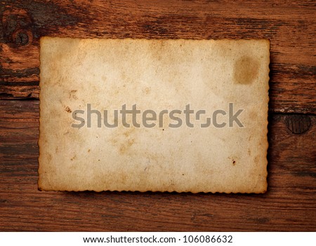 close up of an old photo on a wooden background