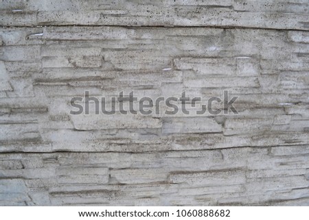 The background of the gray wall of the concrete fence. Texture
