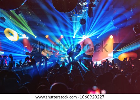 dj night club party rave with crowd in music festive Royalty-Free Stock Photo #1060920227