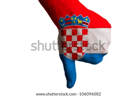 Hand with thumb down gesture in colored croatia national flag as symbol of negative political, cultural, social management of country