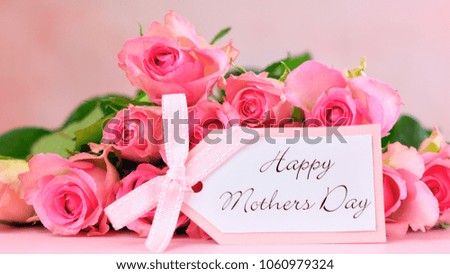 Pink roses on pink wood table, Happy Mother's Day background closeup.