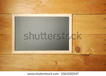 School empty wooden blackboard on wooden floor. Education concept. Back to school theme. Top view and flat lay