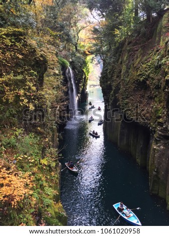 Picture of Takachiho Gorge Japan, is a narrow chasm cut through the rock by the Gokase River. Parthway along the gorge is the 17meter high Minainotaki Waterfall cascading down to the river below.