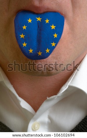 man with open mouth spreading tongue colored in europe flag as symbol of values like teaching, learning, multilingual speaking different of languages