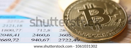 The coin of crypto currency bitcoin against background euro banknote subject gold exchange pyramid for money in connection with the growth or fall exchange rate closeup.