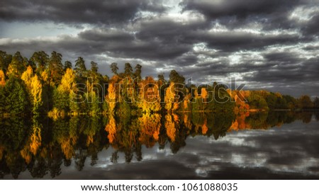 Bulganinskoe lake near the autumn forest 