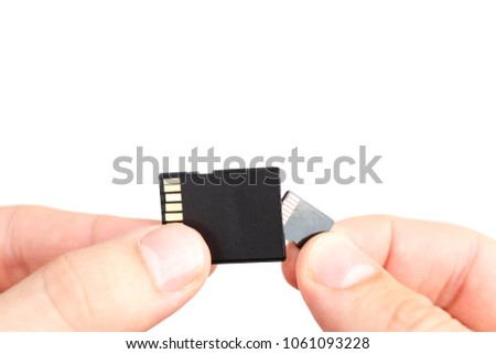 Small Flash card in hand isolated on white background
