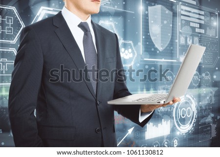 Businessman using laptop with abstract digital blockchain hologram. Innovation and cryptography concept 