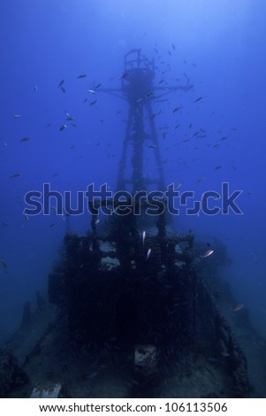 Underwater shipwrecks crows nest with a blue water background in Key Largo, Florida. The Coast Guard Cutter Duane in John Pennekamp State Park. Royalty-Free Stock Photo #106113506