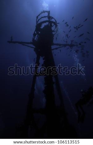 Silhouette of Underwater shipwrecks crows nest with a blue water background in Key Largo, Florida. The Coast Guard Cutter Duane in John Pennekamp State Park. Royalty-Free Stock Photo #106113515