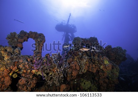 Underwater shipwrecks crows nest with a blue water background in Key Largo, Florida. The Coast Guard Cutter Duane in John Pennekamp State Park. Royalty-Free Stock Photo #106113533