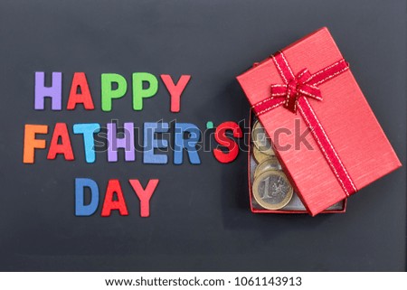 gift box and father's day on black borad background