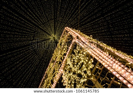 Looking up at the lights of the Christmas decorations in the city square at Cluj, Romania